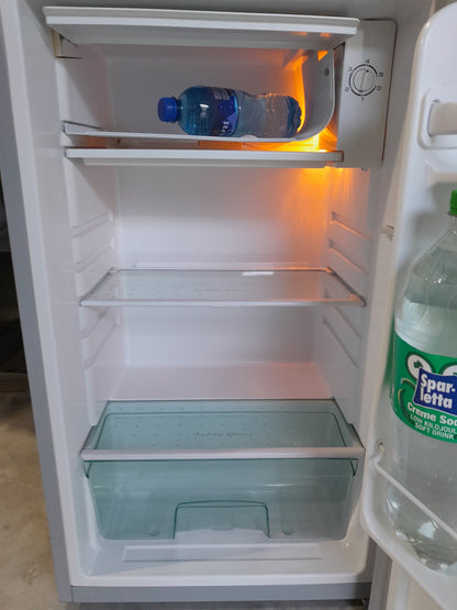 Open Salton bar fridge displaying spacious interior and glass shelves for beverages.