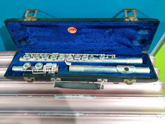 Open case displaying an exquisite King Flute with B foot joint and gizmo key for sale.