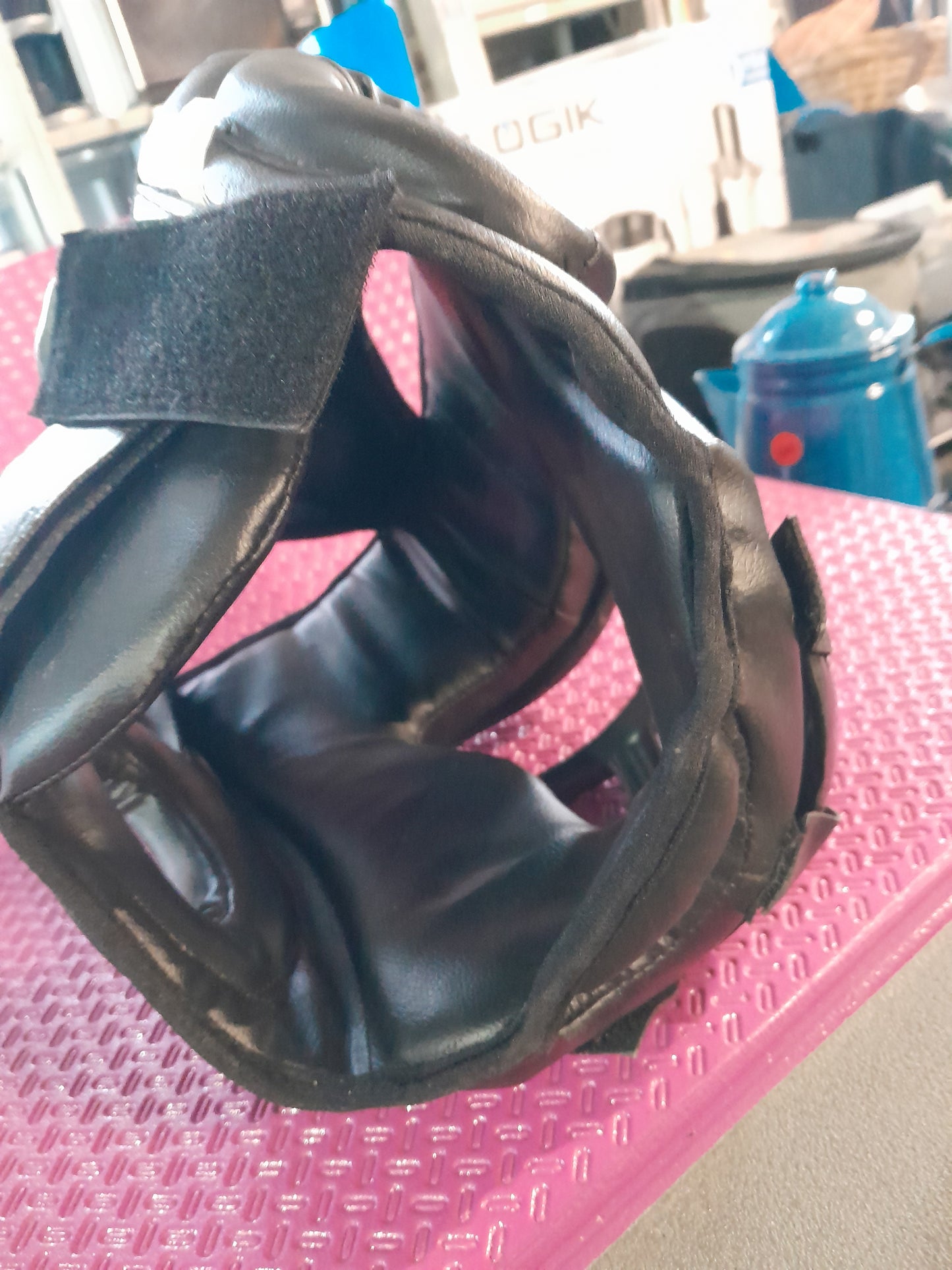 Black sparring boxing headgear designed for combat sports, ensuring maximum protection and durability.