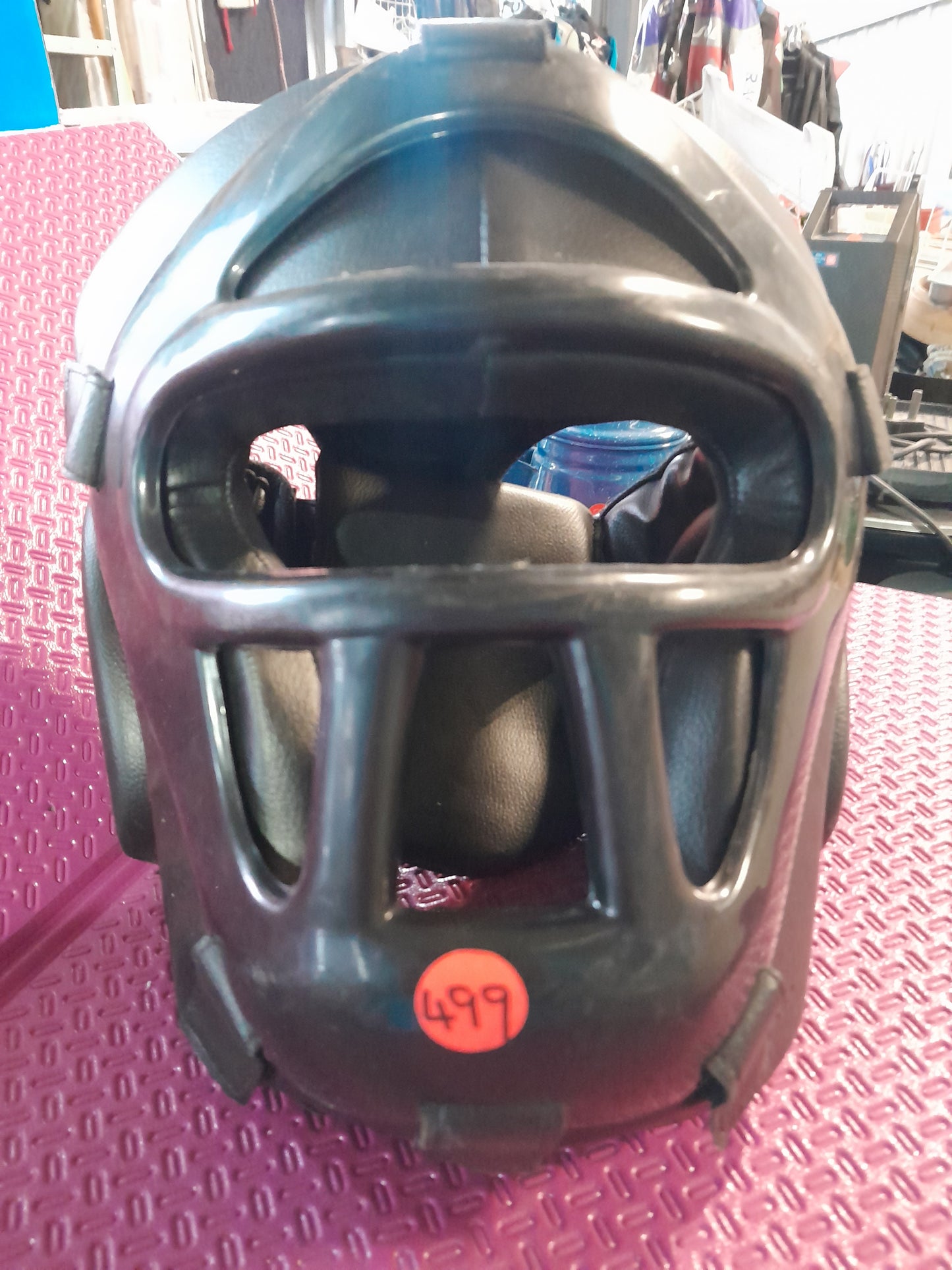 Protective headgear for MMA and boxing, crafted from durable leather for safety during sparring.
